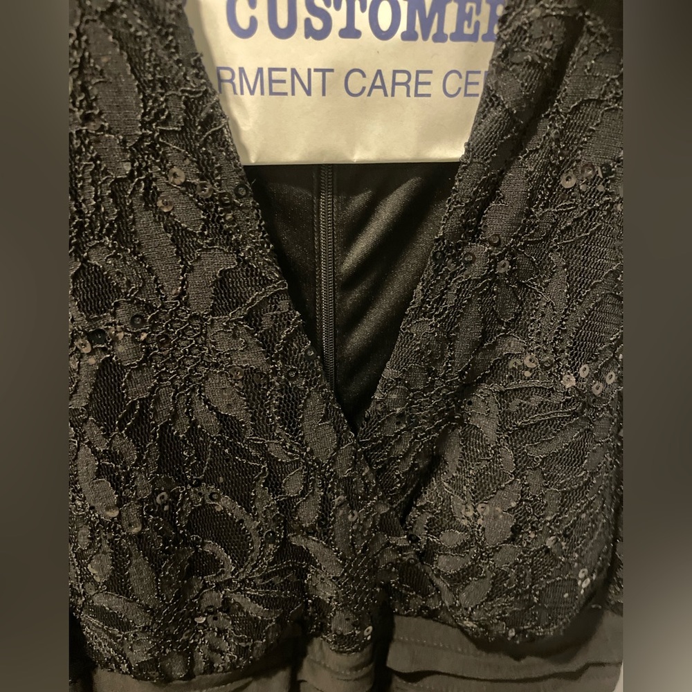 Black capped sleeve cocktail dress. Black. Size 4 petite Worn twice. Dry cleaned